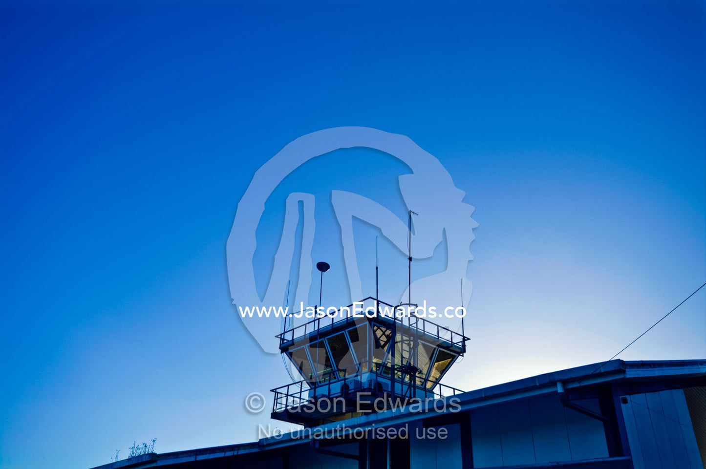 Sunrise over the control tower of a tropical island airport. Neiafu Airport, Port of Refuge, Neiafu, Vava'u Island Group, Pacific Ocean, Oceania, Kingdom of Tonga.