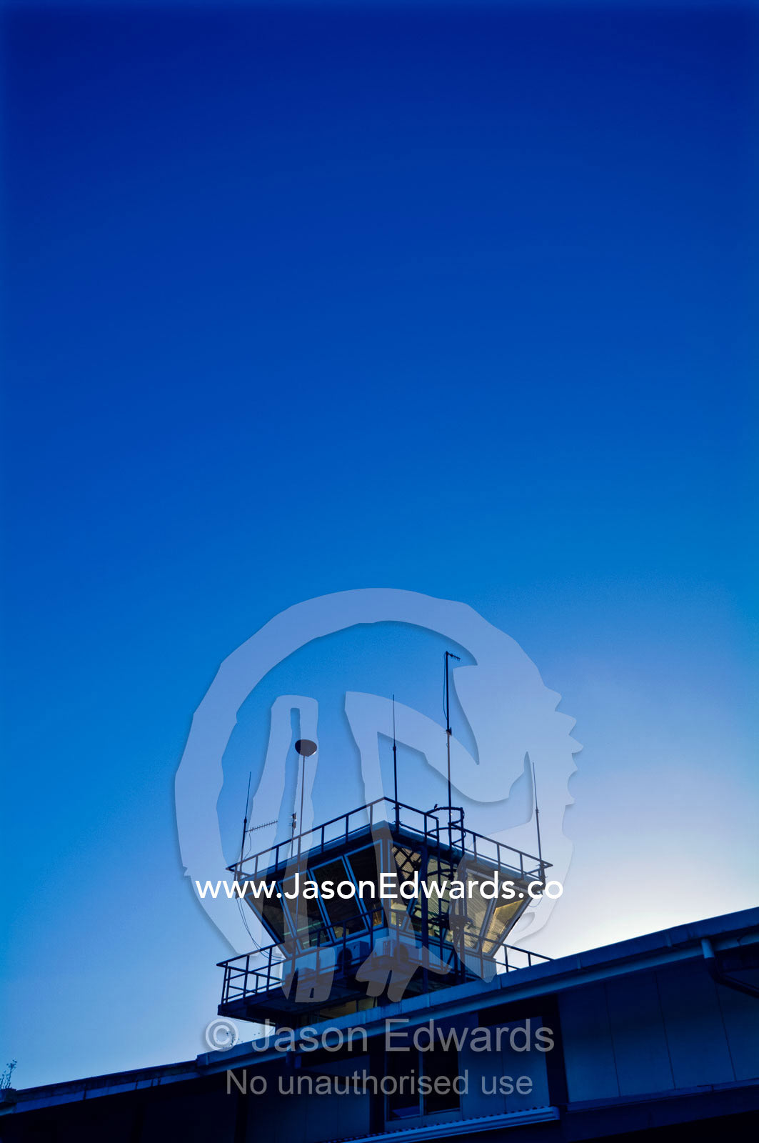 Sunrise over the control tower of a tropical island airport. Neiafu Airport, Port of Refuge, Neiafu, Vava'u Island Group, Pacific Ocean, Oceania, Kingdom of Tonga.