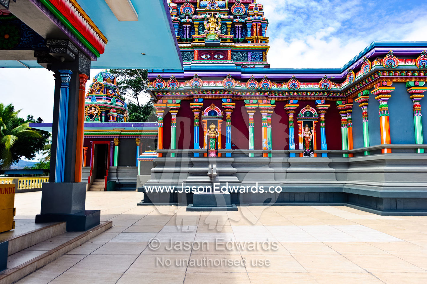 Colorful pillars and statues adorn the courtyard of a Hindu Temple. Sri Siva Subramaniya Swami Temple, Nadi, Pacific Ocean, Fiji Islands.