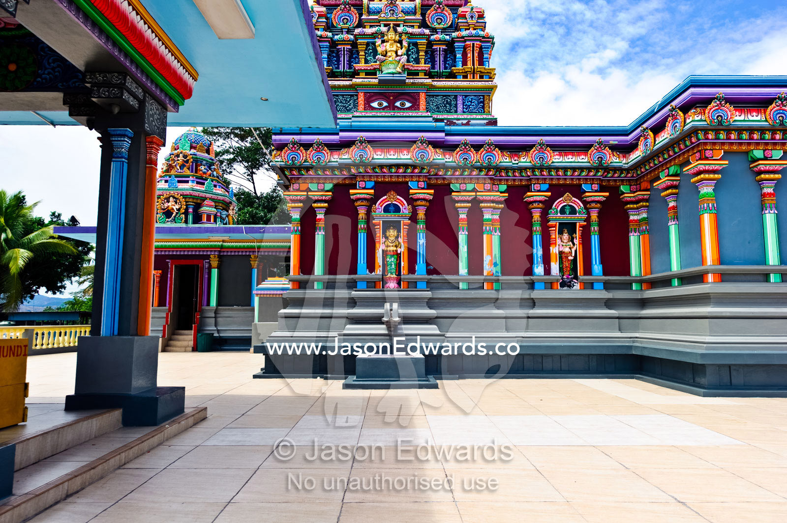 Colorful pillars and statues adorn the courtyard of a Hindu Temple. Sri Siva Subramaniya Swami Temple, Nadi, Pacific Ocean, Fiji Islands.