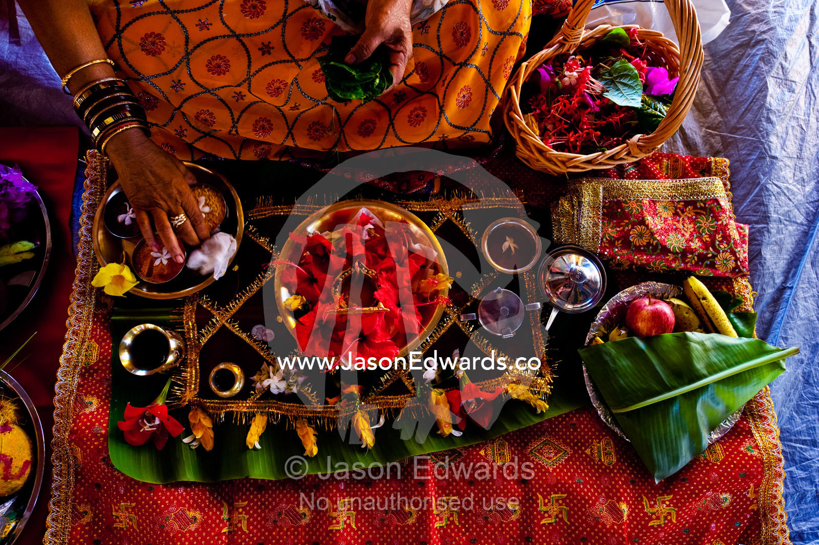 A woman prepares an intricate meal for a prayer offering at a temple. Sri Siva Subramaniya Swami Temple, Nadi, Pacific Ocean, Fiji Islands.