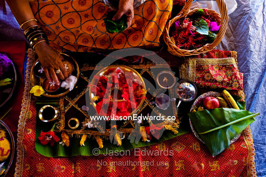 A woman prepares an intricate meal for a prayer offering at a temple. Sri Siva Subramaniya Swami Temple, Nadi, Pacific Ocean, Fiji Islands.