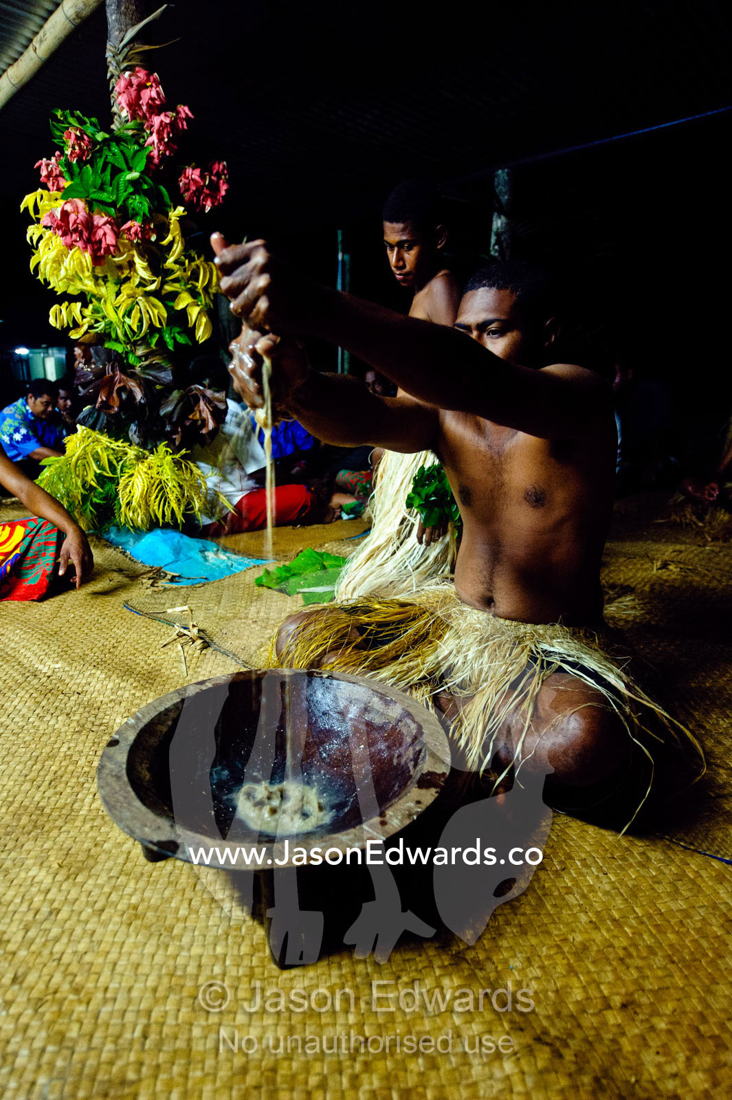 Preparing and squeezing kava to drink at a traditional ceremony. Wiwi Village, Taveuni Island, Pacific Ocean, Fiji Islands.