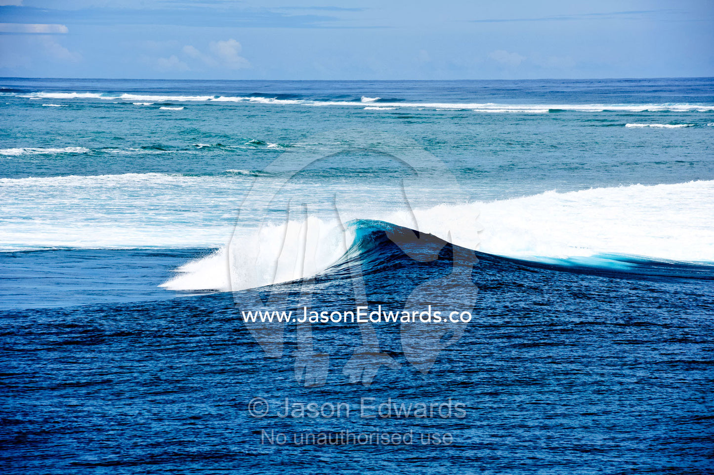 An empty peeling wave on the famous surfing reef known as Cloudbreak. Cloudbreak Reef, Tavarua Island, Pacific Ocean, Fiji Islands.