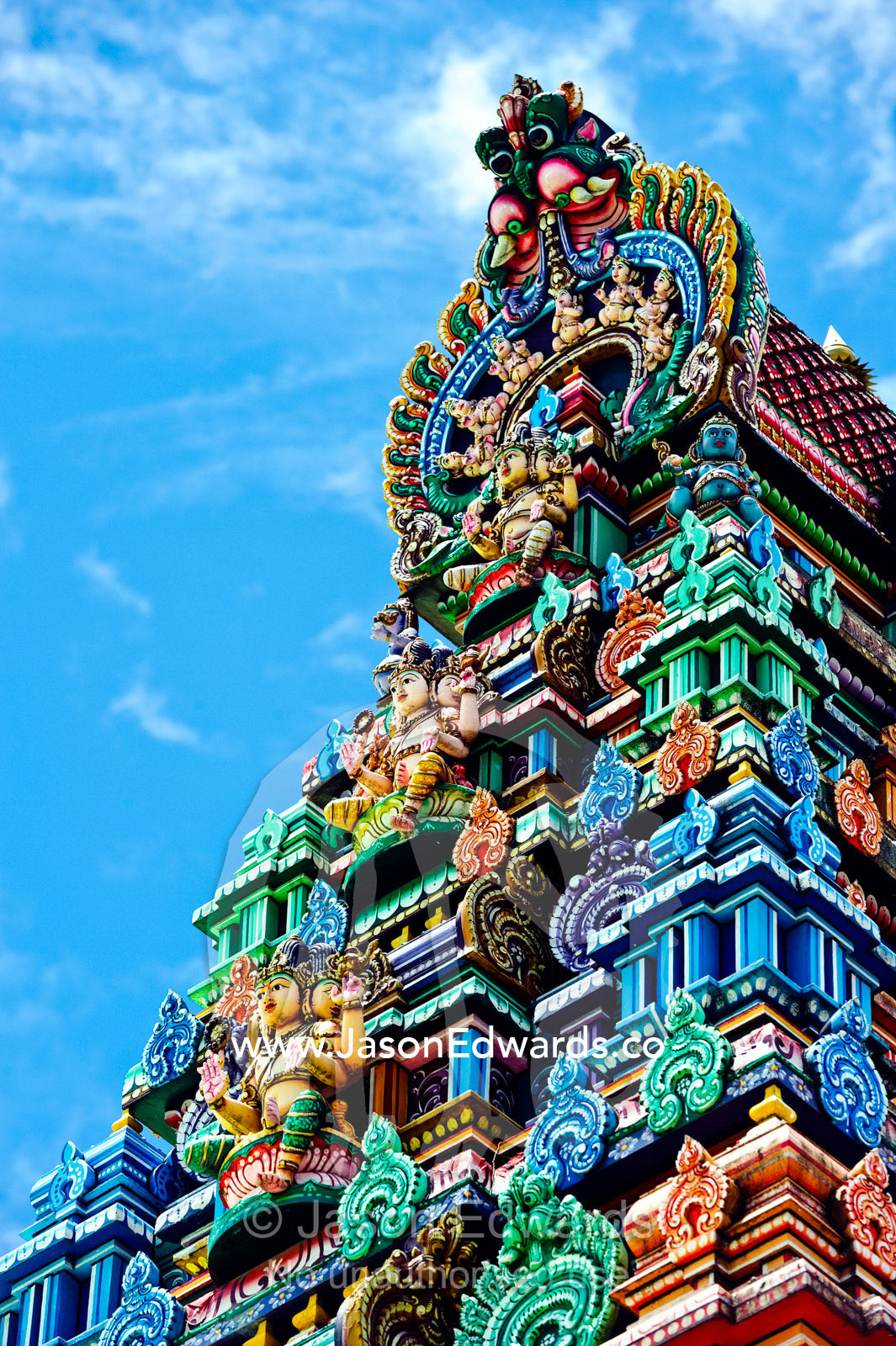 Brightly colored ornate statues and pillars at a Hindu temple. Sri Siva Subramaniya Swami Temple, Nadi, Pacific Ocean, Fiji Islands.