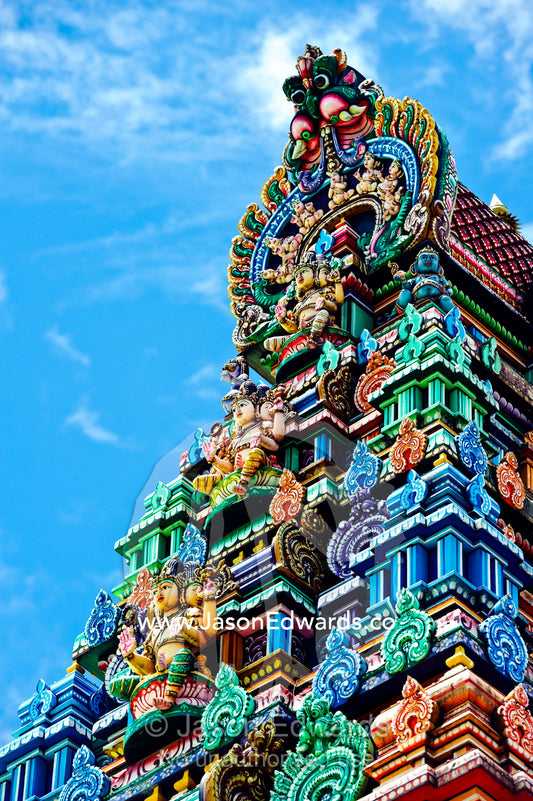 Brightly colored ornate statues and pillars at a Hindu temple. Sri Siva Subramaniya Swami Temple, Nadi, Pacific Ocean, Fiji Islands.