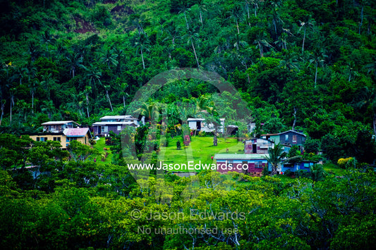 A small agricultural village on a forested slope on a tropical island. Qamea Island, Pacific Ocean, Fiji Islands.