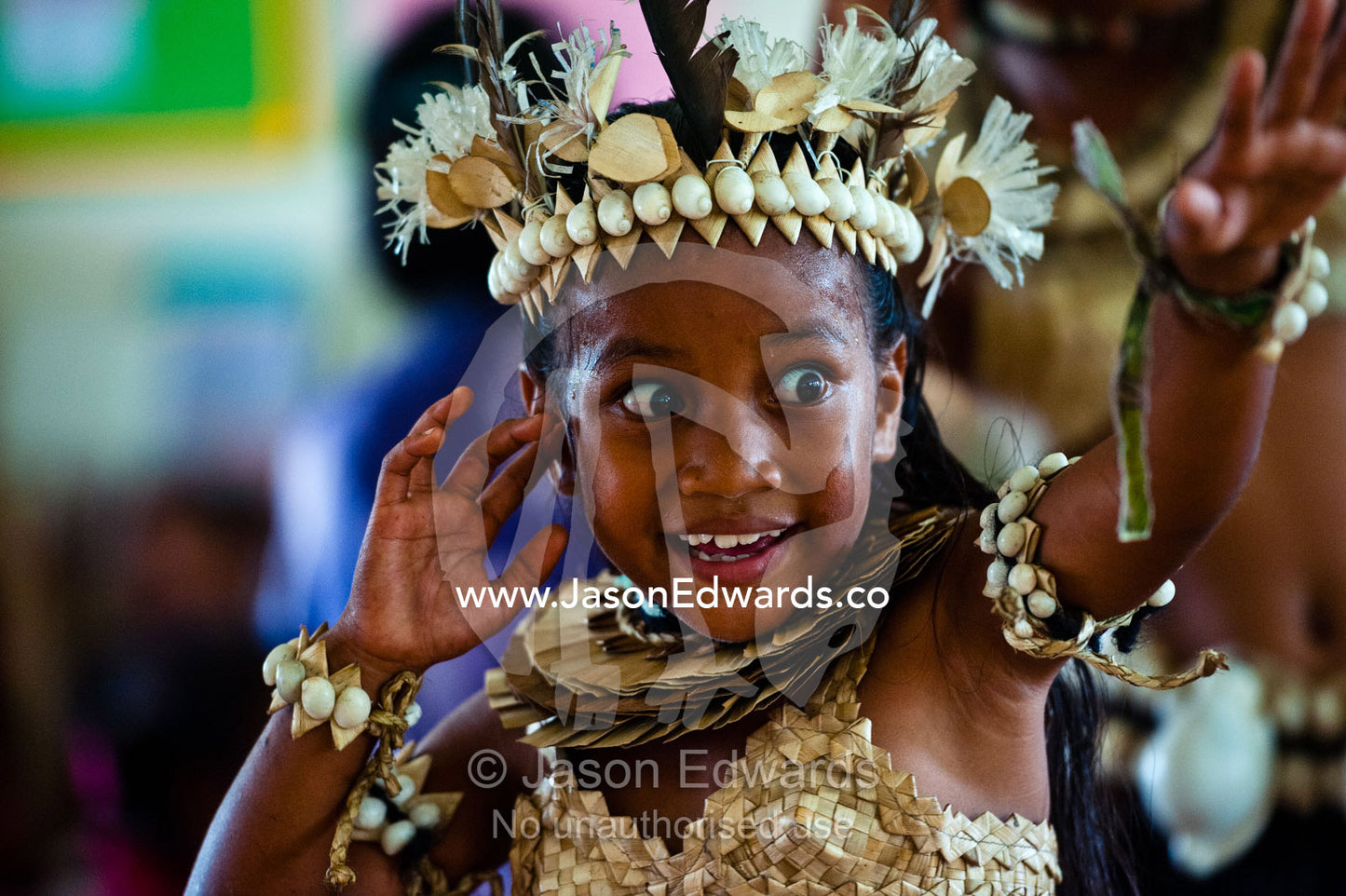 A Micronesian girl performs a dance in seashells and palm leaves. Tabiang Village, Rabi Island, Somosomo Strait, Pacific Ocean, Fiji Islands.