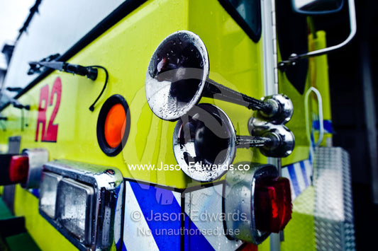 The polished silver horns of a airport emergency fire engine truck. Nausori Airport, Viti Levu Island, Pacific Ocean, Fiji Islands.