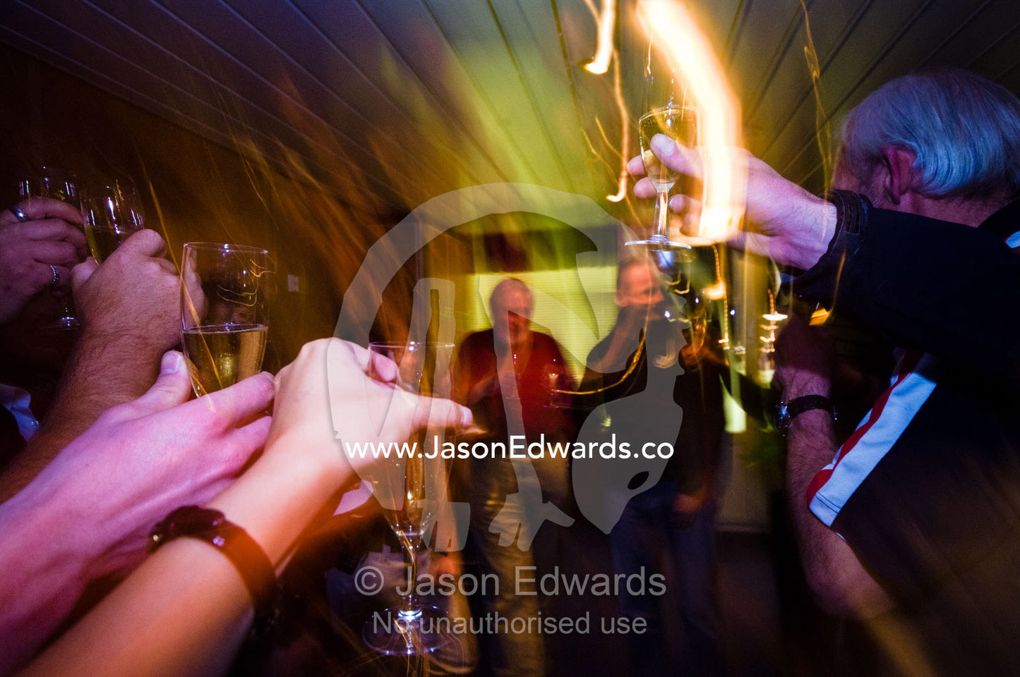 Tourists toast their safe return from Antarctica with champagne. The Beagle Channel, Tierra del Fuego Archipelago, Straits of Magellan, Ushuaia, Tierra del Fuego Province, Patagonia, Argentina.
