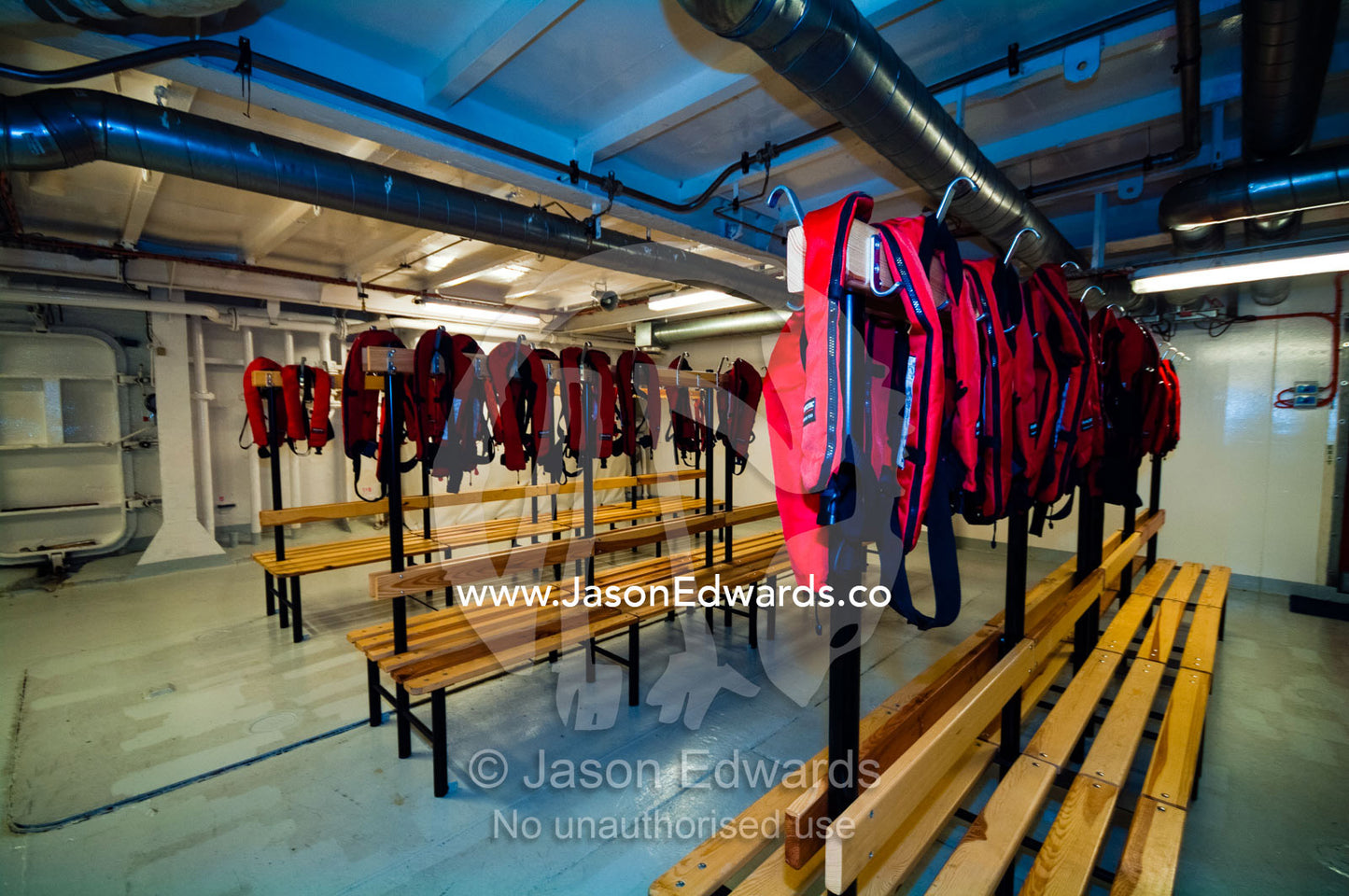 Life jackets for tourists in the mud room of an Antarctic ship's hull. The Beagle Channel, Tierra del Fuego Archipelago, Strait of Magellan, Ushuaia, Tierra del Fuego Province, Patagonia, Argentina.