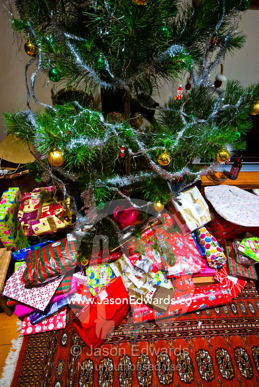 Gifts beneath a Christmas tree on Christmas Eve in a country town. Castlemaine, Victoria, Australia.