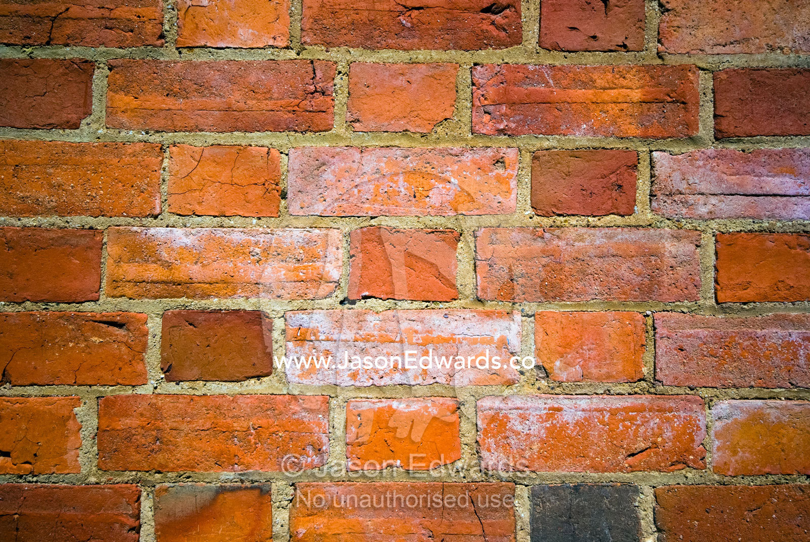 A weathered wall in a small country church made of red bricks. Elphinstone, Victoria, Australia.