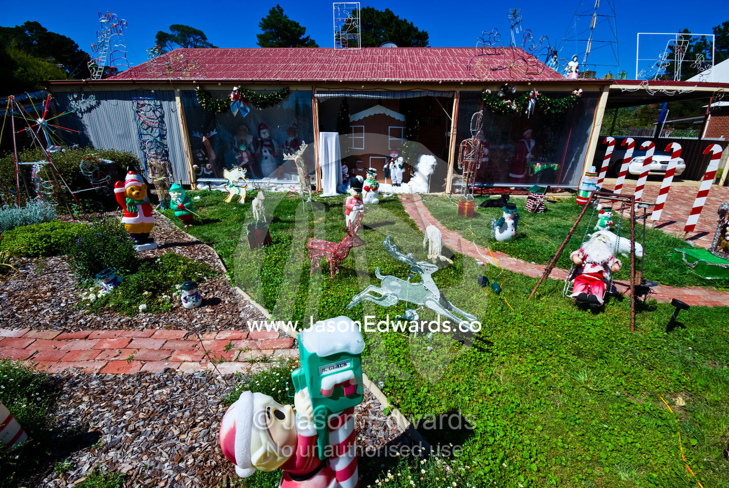 Christmas decorations in the front yard of a gold mining town house. Chewton, Victoria, Australia.