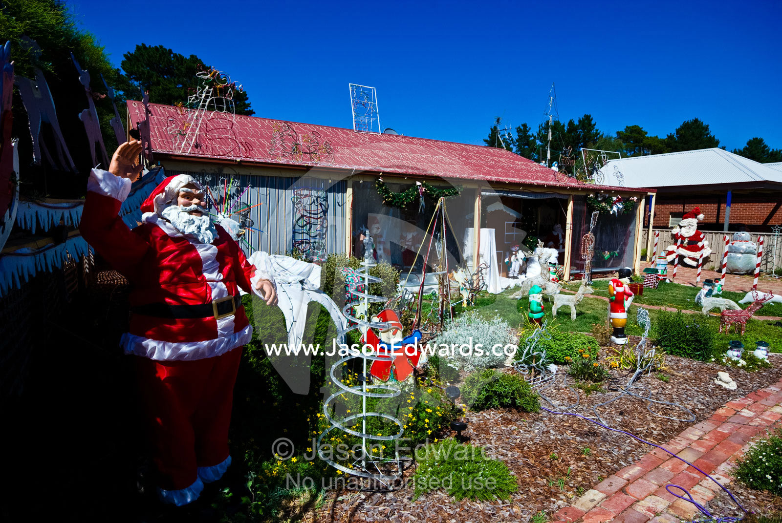 Christmas decorations in the front yard of a gold mining town house. Chewton, Victoria, Australia.