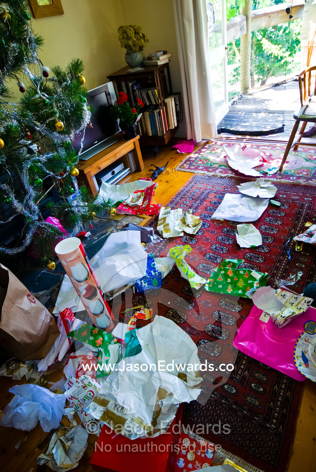The chaos of wrapping paper removed from gifts on Christmas morning. Castlemaine, Victoria, Australia.