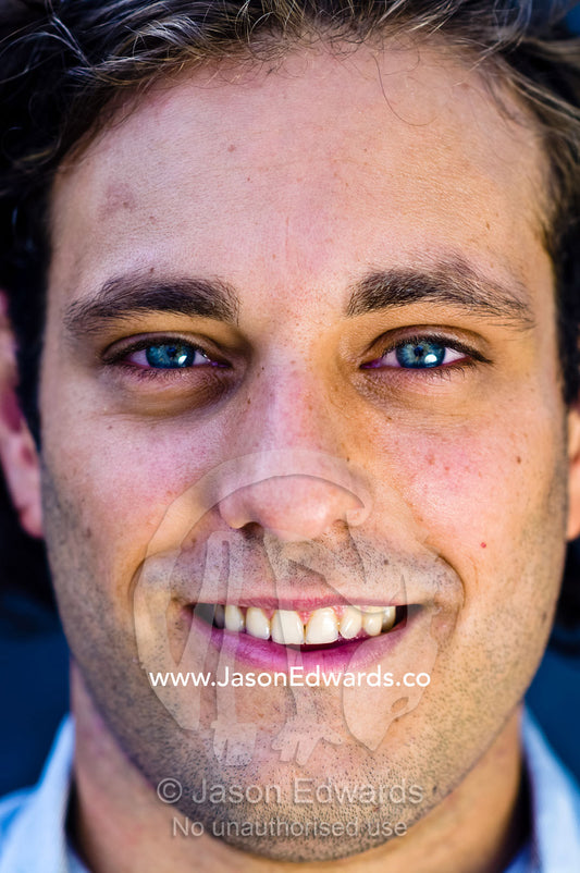 A portrait of a well-dressed young and attractive man smiling. Carlton, Melbourne, Victoria, Australia.