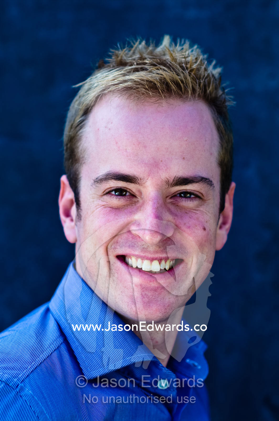 A portrait of a well-dressed young and attractive man smiling. Carlton, Melbourne, Victoria, Australia.