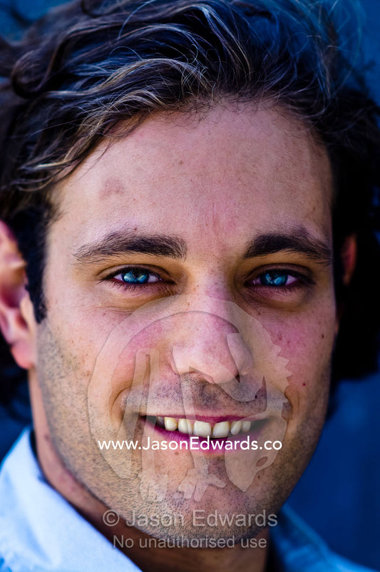 A portrait of a well-dressed young and attractive man smiling. Carlton, Melbourne, Victoria, Australia.