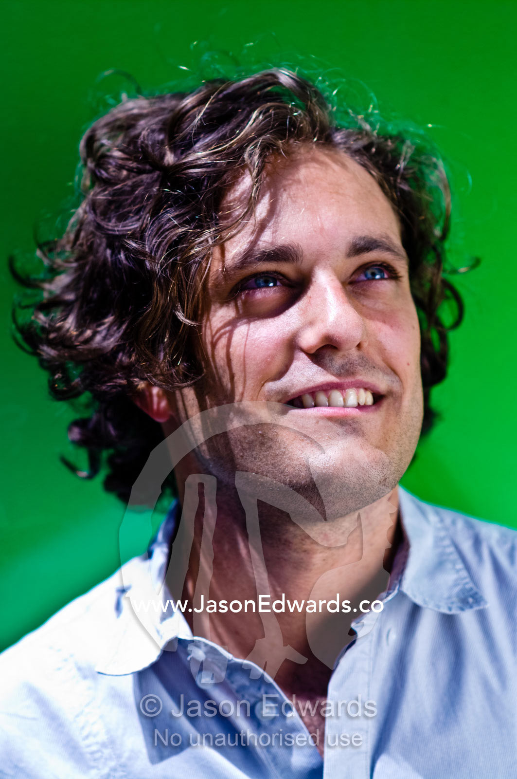 A portrait of a well-dressed young and attractive man smiling. Carlton, Melbourne, Victoria, Australia.