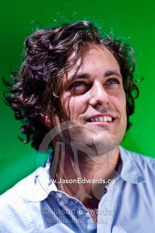 A portrait of a well-dressed young and attractive man smiling. Carlton, Melbourne, Victoria, Australia.