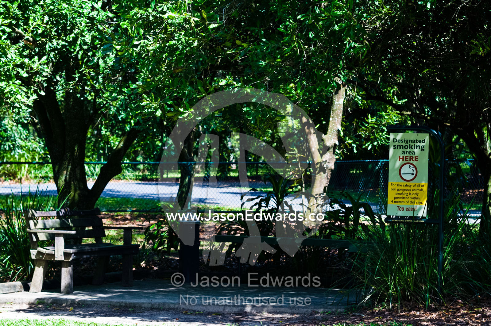 A smoking sign in a zoo garden highlights current public attitude. Australia Zoo, Beerwah, Queensland, Australia.