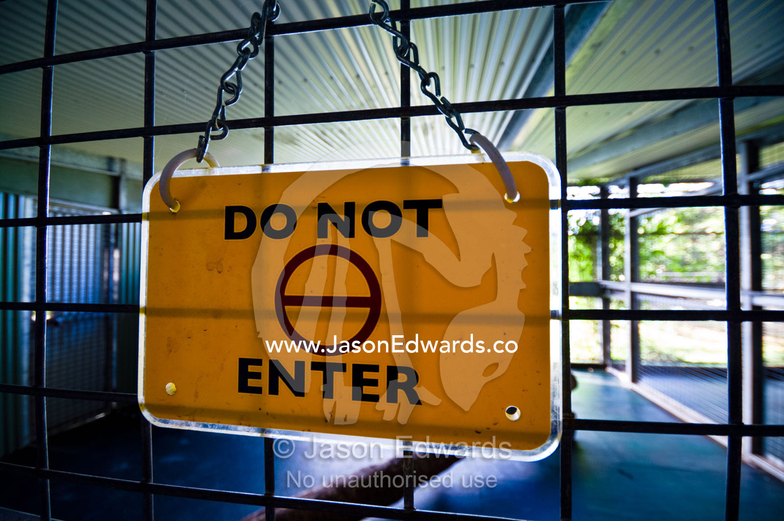 A safety warning sign on a Sumatran Tiger holding cage in a zoo. Australia Zoo, Beerwah, Queensland, Australia.