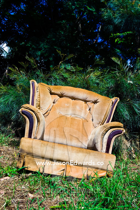 An old armchair by the roadside waiting as garbage or for adoption. Witta, Sunshine Coast, Brisbane, Queensland, Australia.