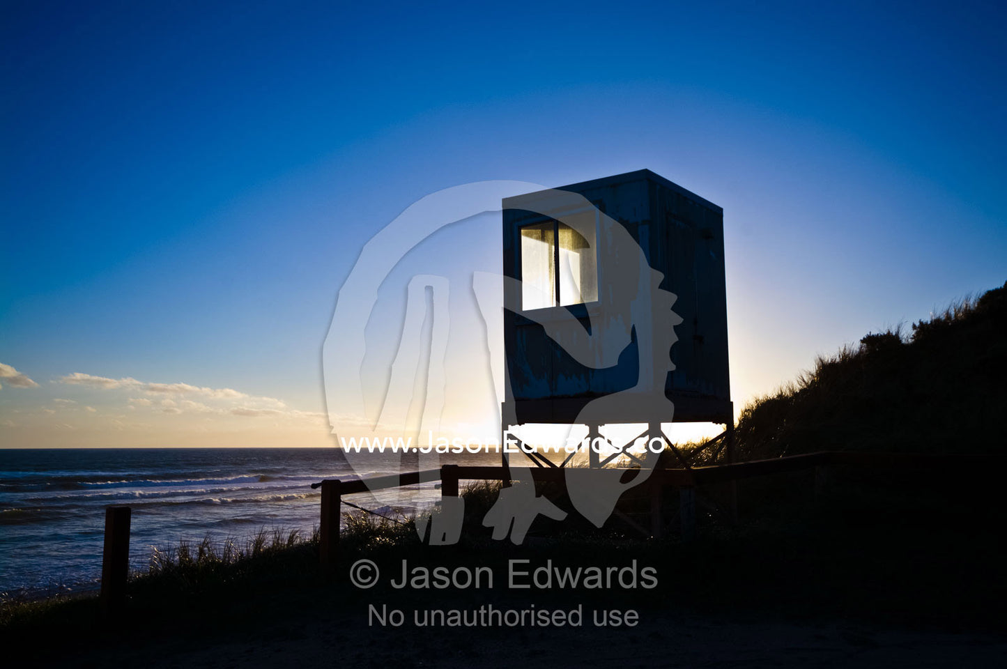 A life saving patrol box atop a sand dune overlooking a wide beach. Venus Bay, Bass Strait, South Gippsland, Victoria, Australia.