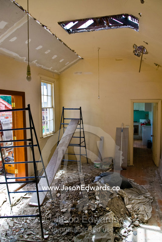 A fireplace is removed from a Victorian home during a renovation. Carlton North, Melbourne, Victoria, Australia.