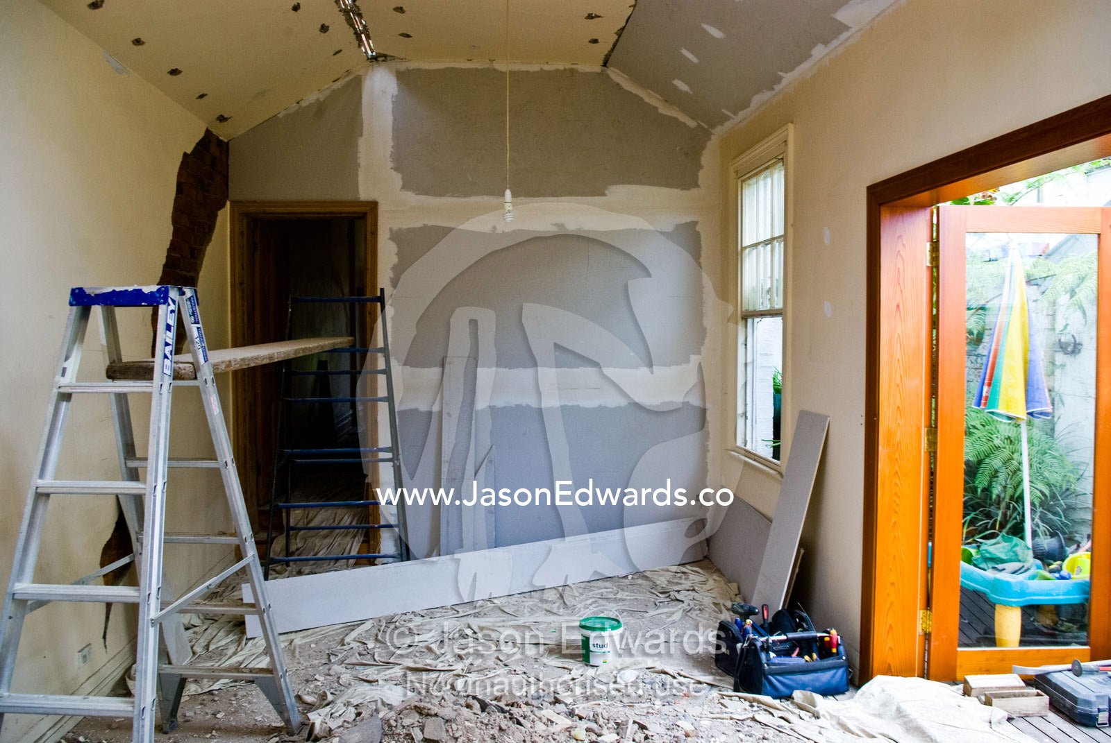 Plastering in a heritage living room during a house renovation. Carlton North, Melbourne, Victoria, Australia.