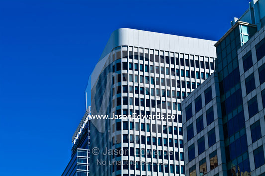 The curved facade of a concrete office block in the business district. Sydney, New South Wales, Australia.