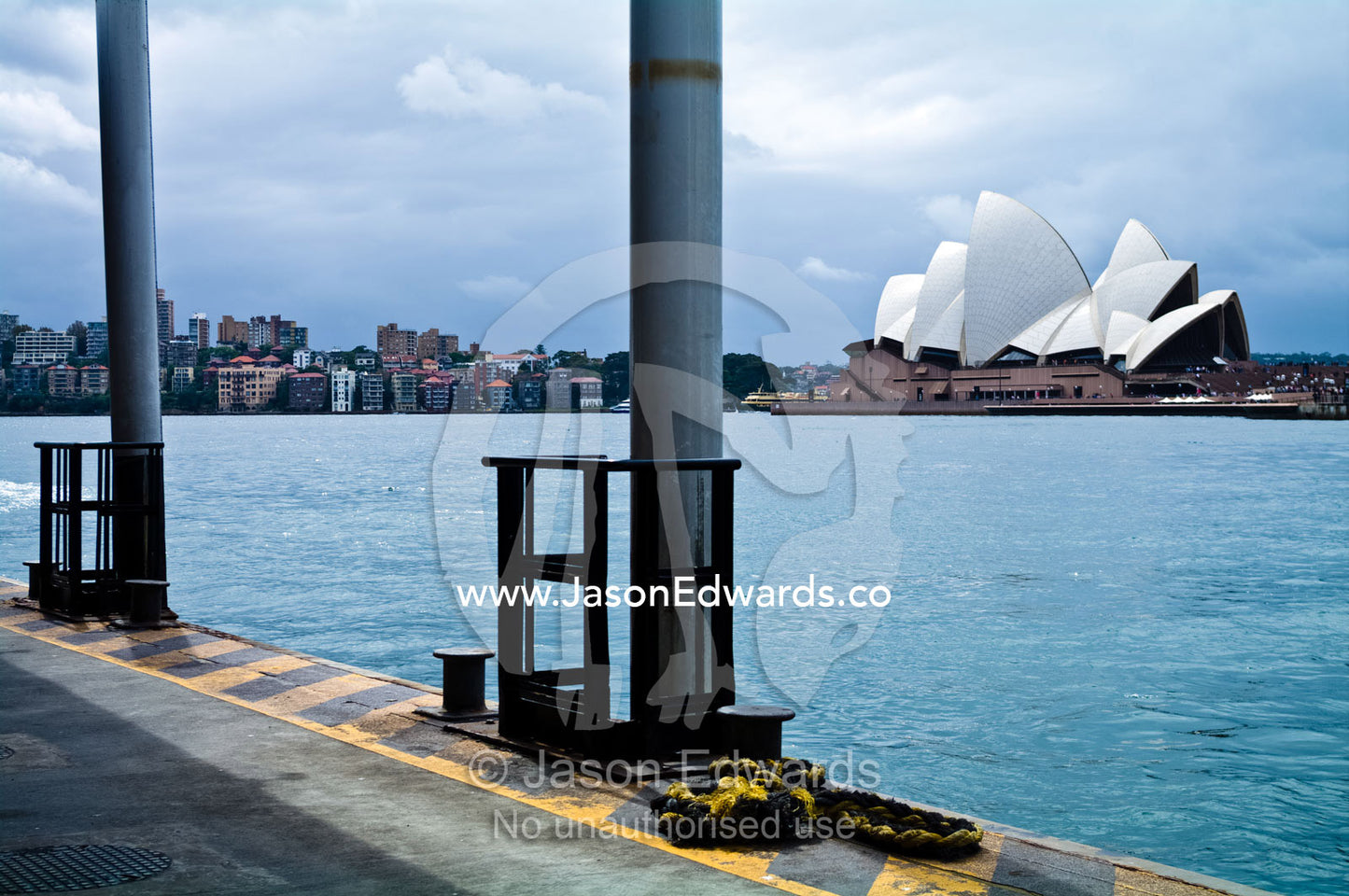 The Sydney Opera House viewed from the ferry port at Circular Quay. Bennelong Point, Sydney Harbour, Sydney Cove, Warrane, Port Jackson, Circular Quay, Sydney, New South Wales, Australia.