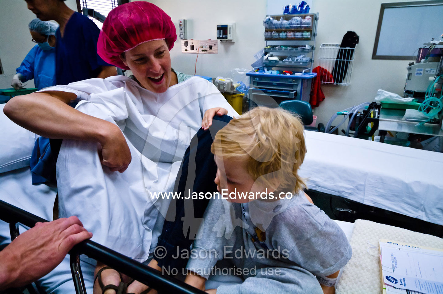 A mother accompanies her son in an operating room for ear surgery. Epworth Freemasons Hospital, East Melbourne, Victoria, Australia.