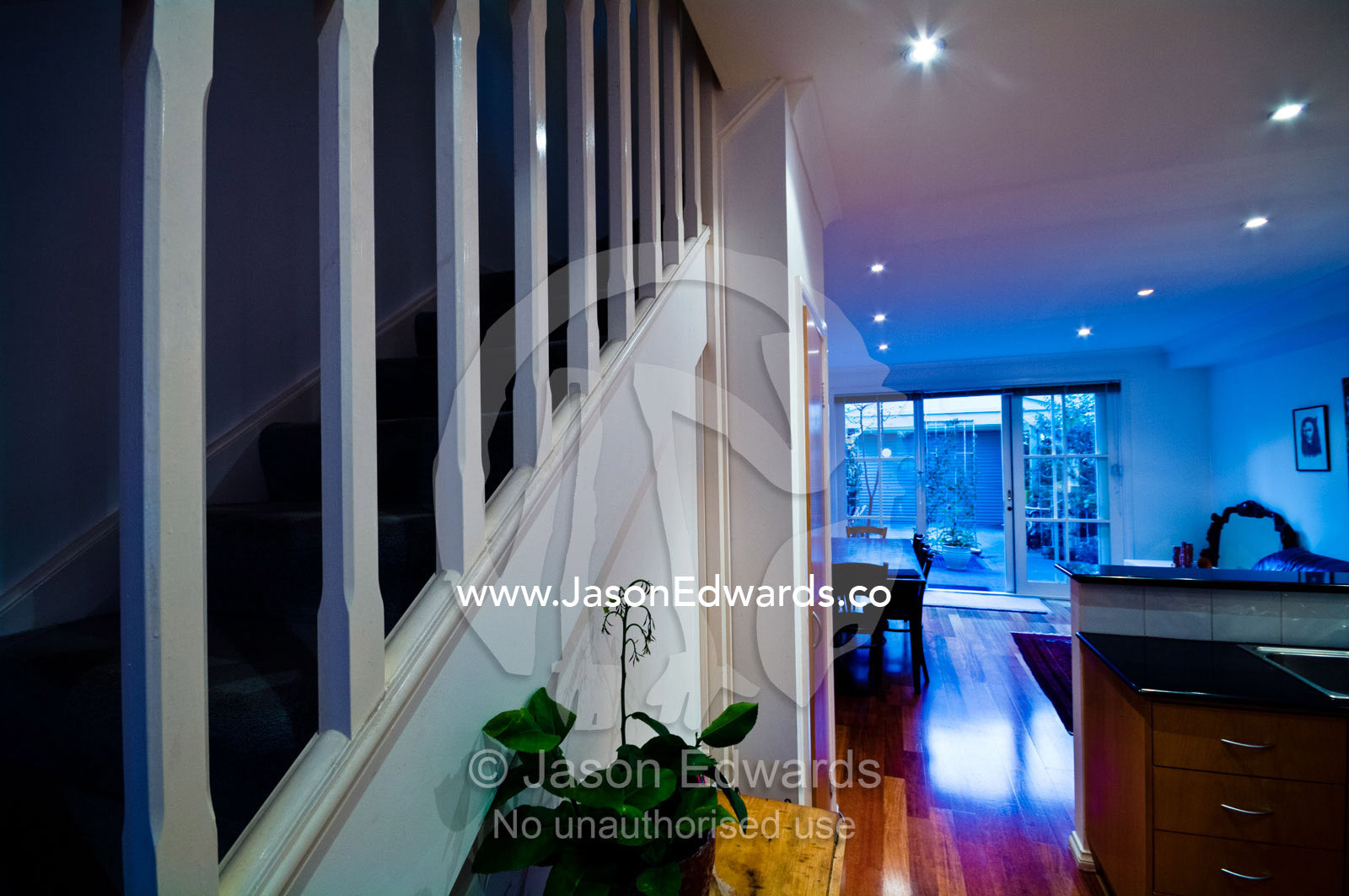 A stairwell and open plan living room in a residential house. Brunswick, Melbourne, Victoria, Australia.