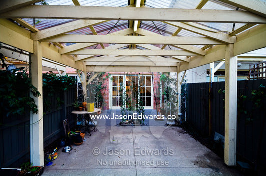A covered car park and entertainment area at the rear of a townhouse. Brunswick, Melbourne, Victoria, Australia.