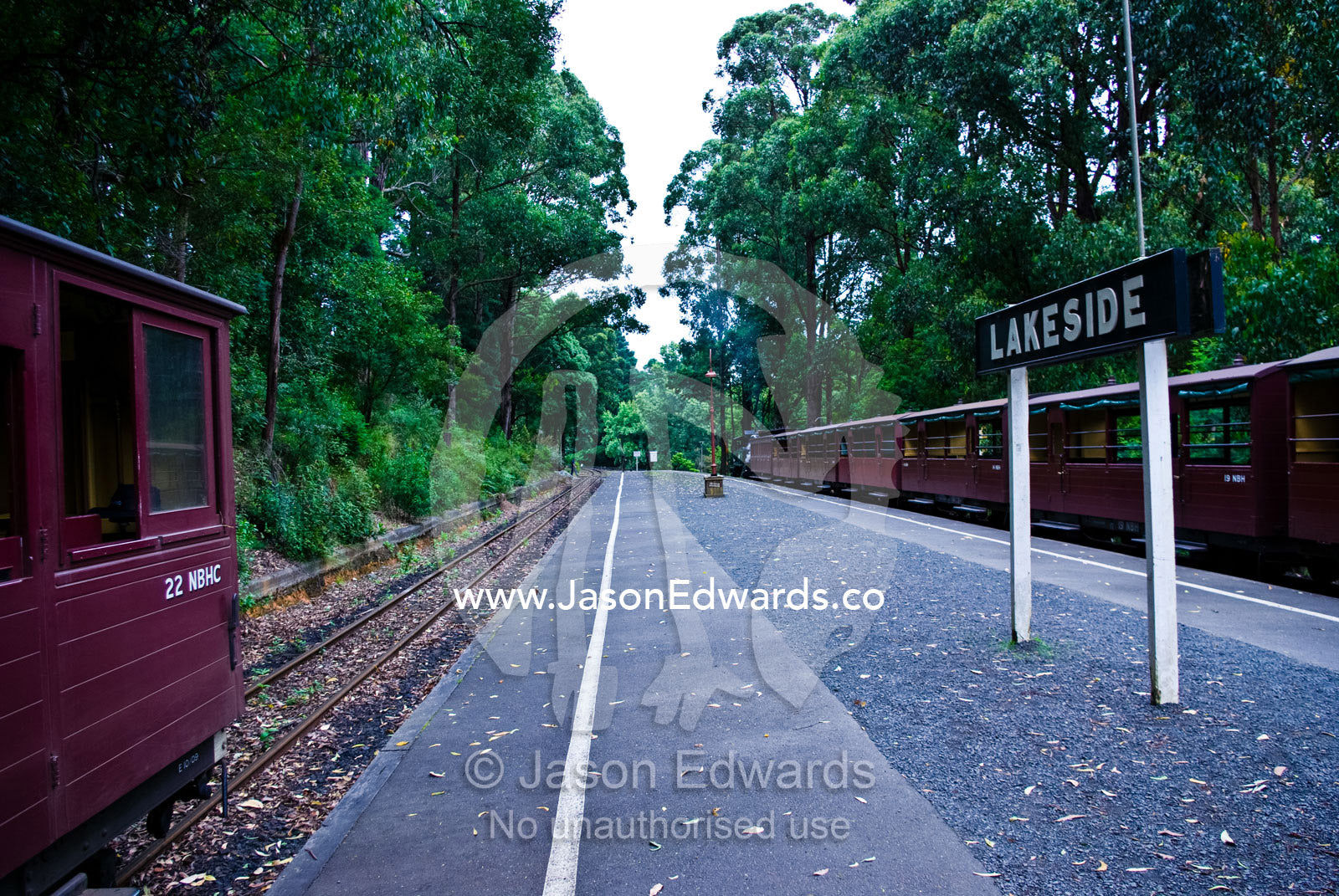 A forest country railway station with antique steam train carriages. Lakeside, Emerald, Melbourne, Victoria, Australia.
