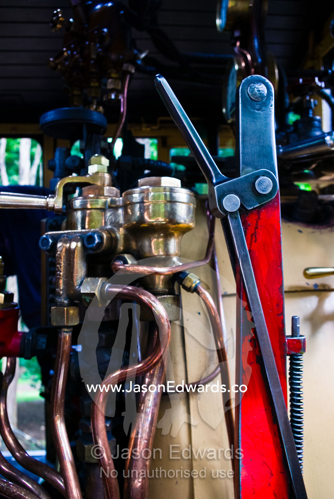 The boiler room and calliper breaks on a restored antique steam train. Lakeside, Emerald, Melbourne, Victoria, Australia.