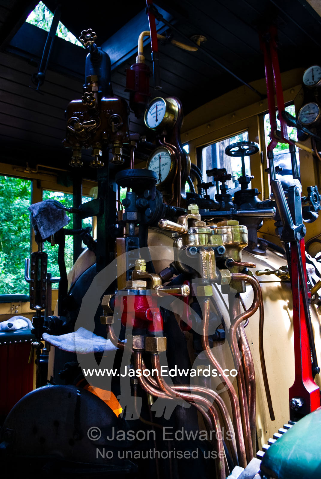 The boiler room and calliper breaks on a restored antique steam train. Lakeside, Emerald, Melbourne, Victoria, Australia.