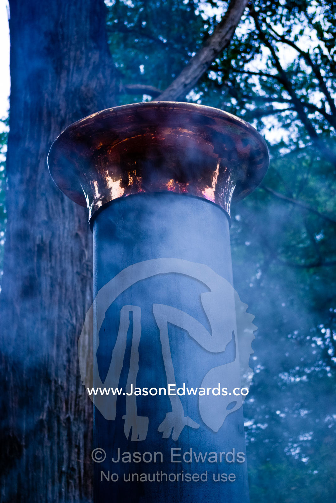 Steam and smoke from the funnel of a restored antique steam train. Lakeside, Emerald, Melbourne, Victoria, Australia.