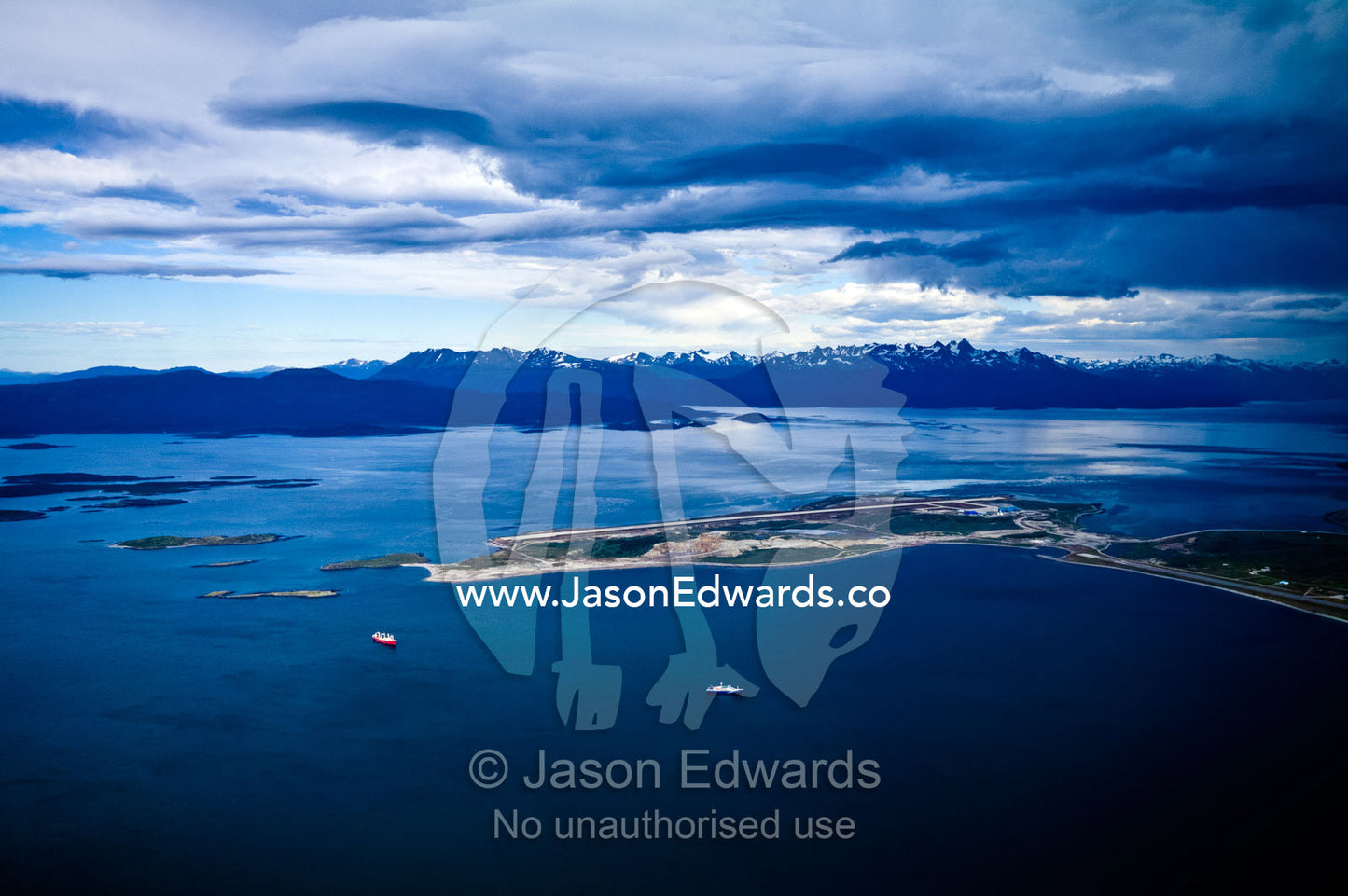 Storm clouds over the Chilean Andes and the Ushuaia port and bay. Ushuaia, Martial Mountains, Fuegian Andes, Ushuaia Bay, The Beagle Channel, Tierra del Fuego Archipelago, Straits of Magellan, Tierra del Fuego Province, Patagonia, Argentina.