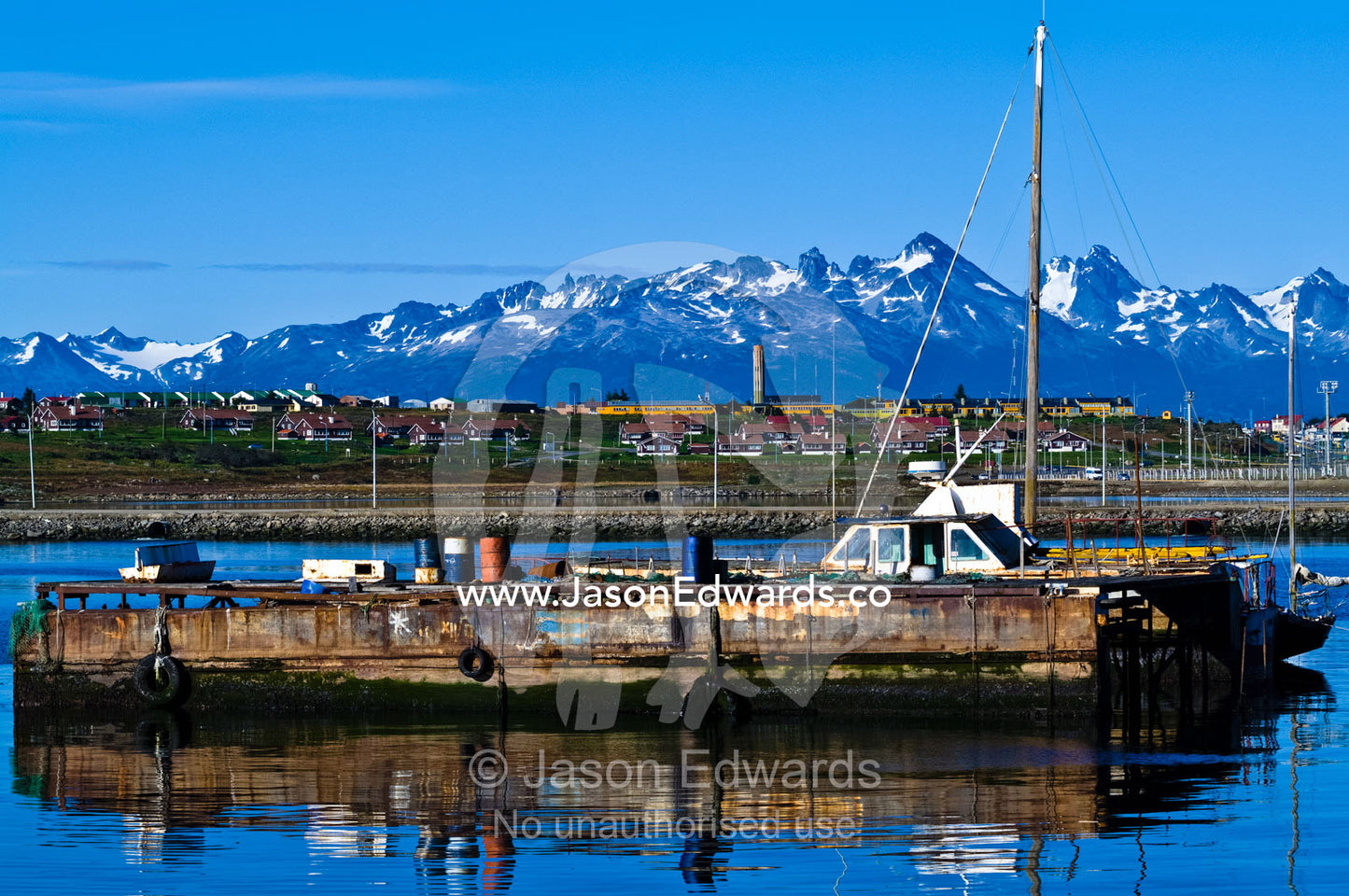 An old rusting dry dock for boat repairs in a sheltered harbour. Ushuaia, Martial Mountains, Fuegian Andes, Ushuaia Bay, The Beagle Channel, Tierra del Fuego Archipelago, Straits of Magellan, Tierra del Fuego Province, Patagonia, Argentina.