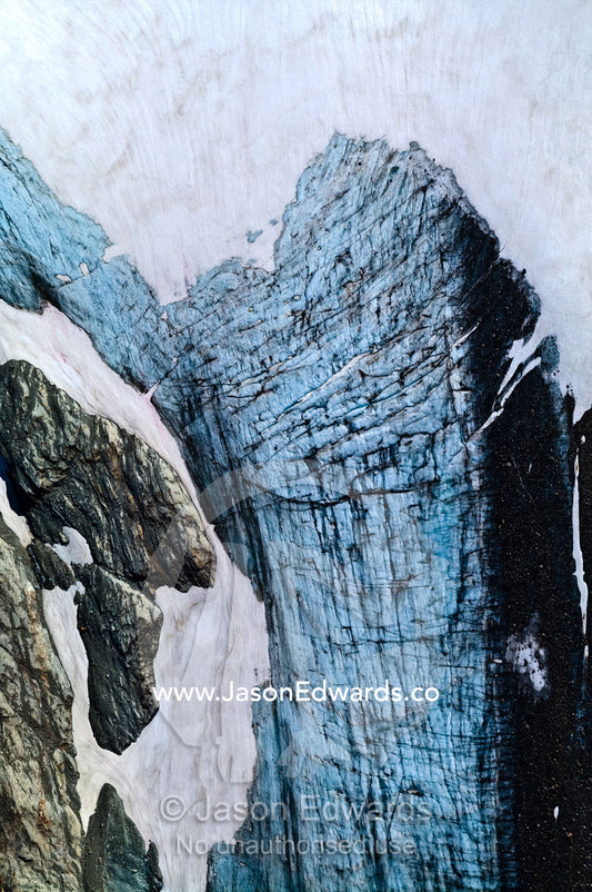 A mosaic of fracture lines on the surface of a weathered glacier. Ushuaia, Martial Mountains, Fuegian Andes, Ushuaia Bay, Tierra del Fuego Archipelago, Straits of Magellan, Tierra del Fuego Province, Patagonia, Argentina.