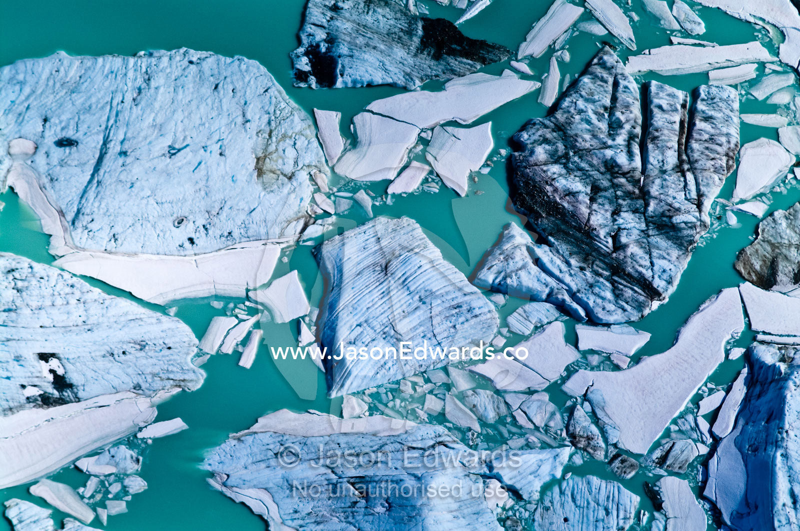 Massive icebergs gather in an alpine lake by a glacier fracture zone. Ushuaia, Martial Mountains, Fuegian Andes, Ushuaia Bay, Tierra del Fuego Archipelago, Straits of Magellan, Tierra del Fuego Province, Patagonia, Argentina.
