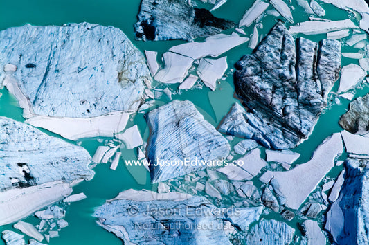 Massive icebergs gather in an alpine lake by a glacier fracture zone. Ushuaia, Martial Mountains, Fuegian Andes, Ushuaia Bay, Tierra del Fuego Archipelago, Straits of Magellan, Tierra del Fuego Province, Patagonia, Argentina.