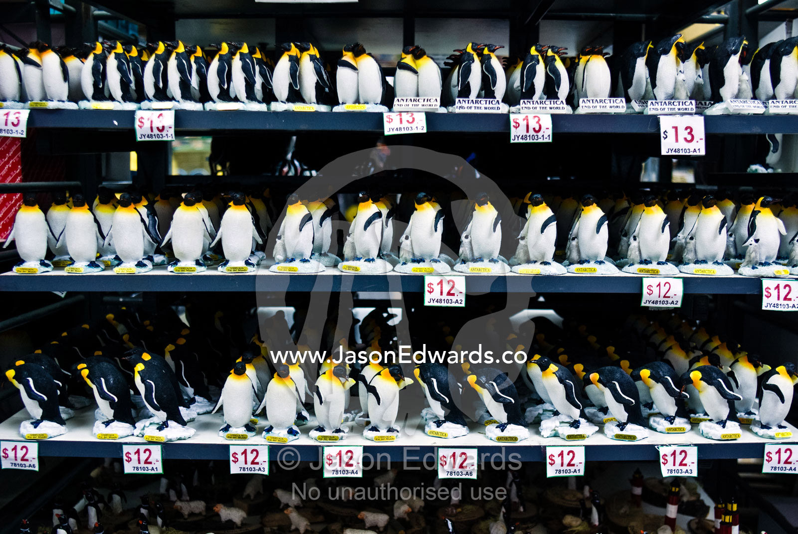 An army of souvenir penguins for sale to tourists visiting Antarctica. Ushuaia, Tierra del Fuego Archipelago, Straits of Magellan, Tierra del Fuego Province, Patagonia, Argentina.