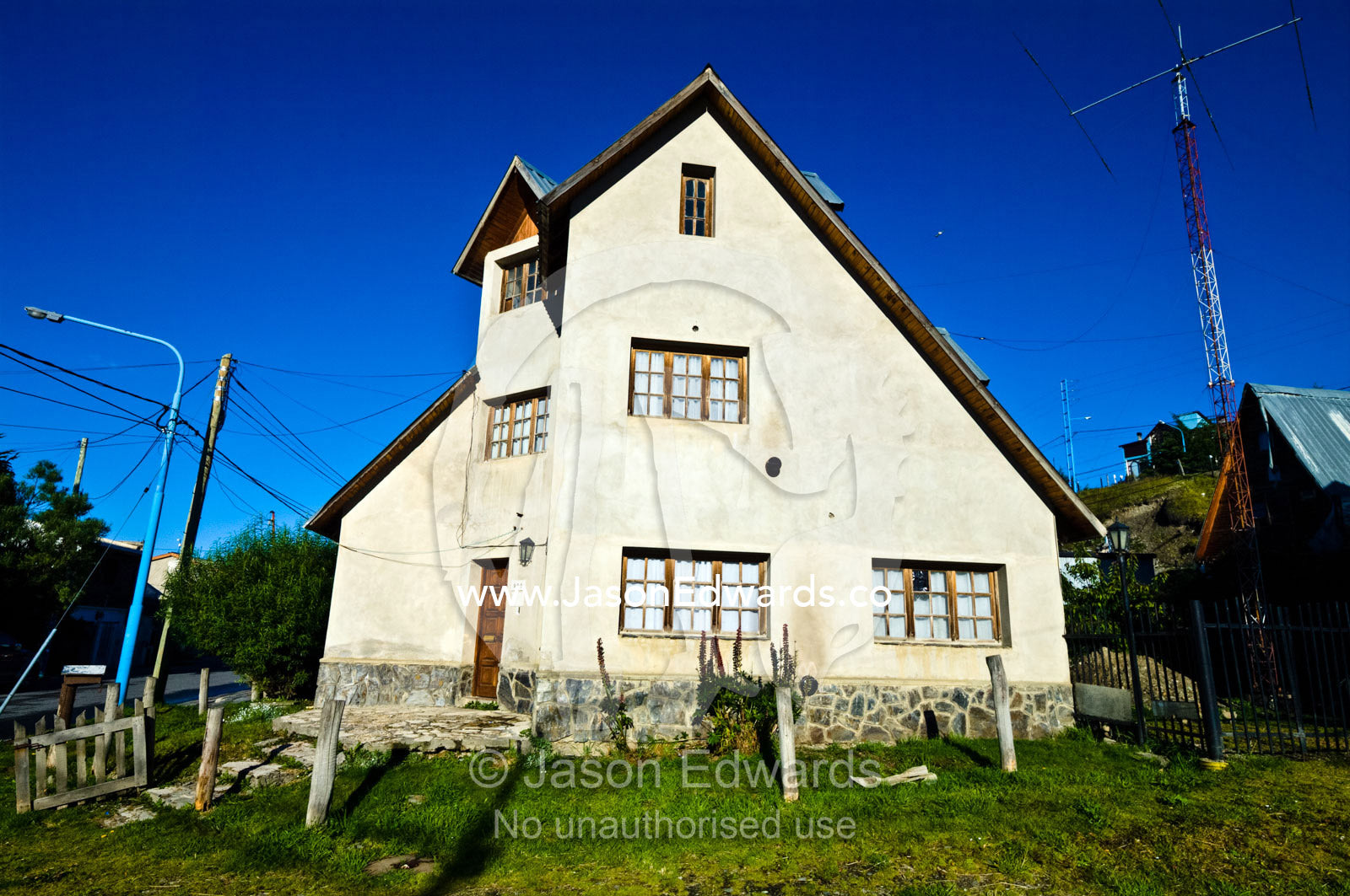 A suburban alpine house with a steep roof to prevent snow building up. Ushuaia, Tierra del Fuego Province, Patagonia, Argentina.