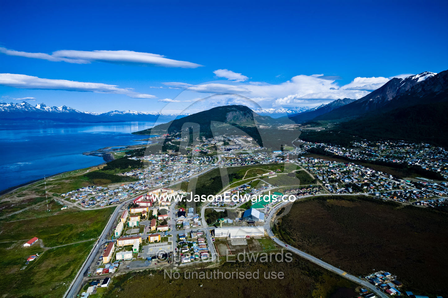 Sprawling suburbs of a city on the forested slopes of the Andes. Ushuaia Bay, The Beagle Channel, Tierra del Fuego Archipelago, Strait of Magellan, Ushuaia, Fuegian Andes, Tierra del Fuego Province, Patagonia, Argentina.