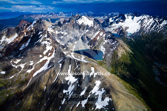 A remote glacial lake cradled by snow and ice draped peaks. Martial Mountains, Fuegian Andes, Tierra del Fuego Archipelago, Strait of Magellan, Tierra del Fuego Province, Patagonia, Argentina.