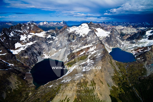Snow and ice draped peaks cradle two remote turquoise glacial lakes. Martial Mountains, Fuegian Andes, Tierra del Fuego Archipelago, Strait of Magellan, Tierra del Fuego Province, Patagonia, Argentina.